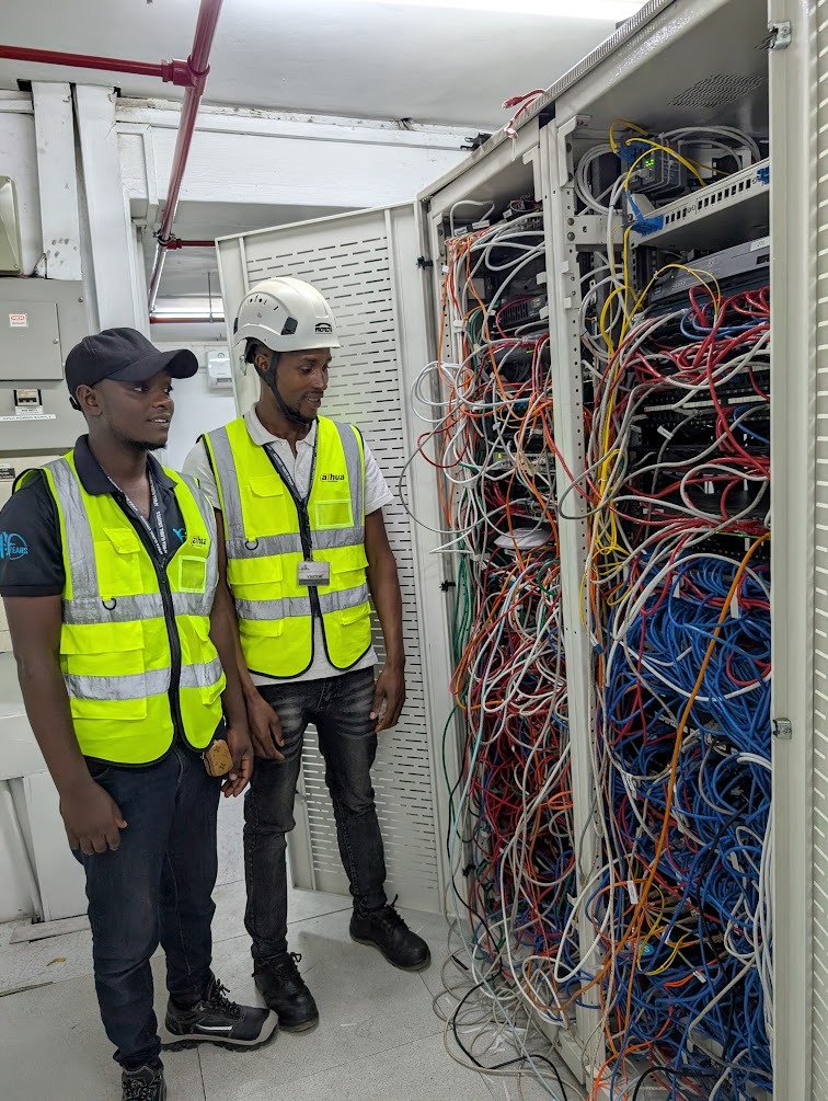Messy server room with tangled cables and no labelling